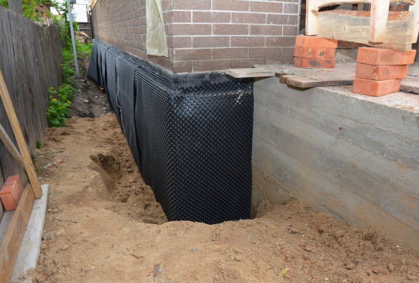 Happy homeowners after waterproofing job in New Vienna